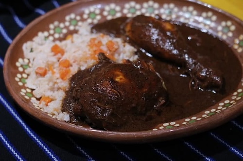 Plate of turkey in mole sauce